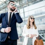 Business woman with security outdoors